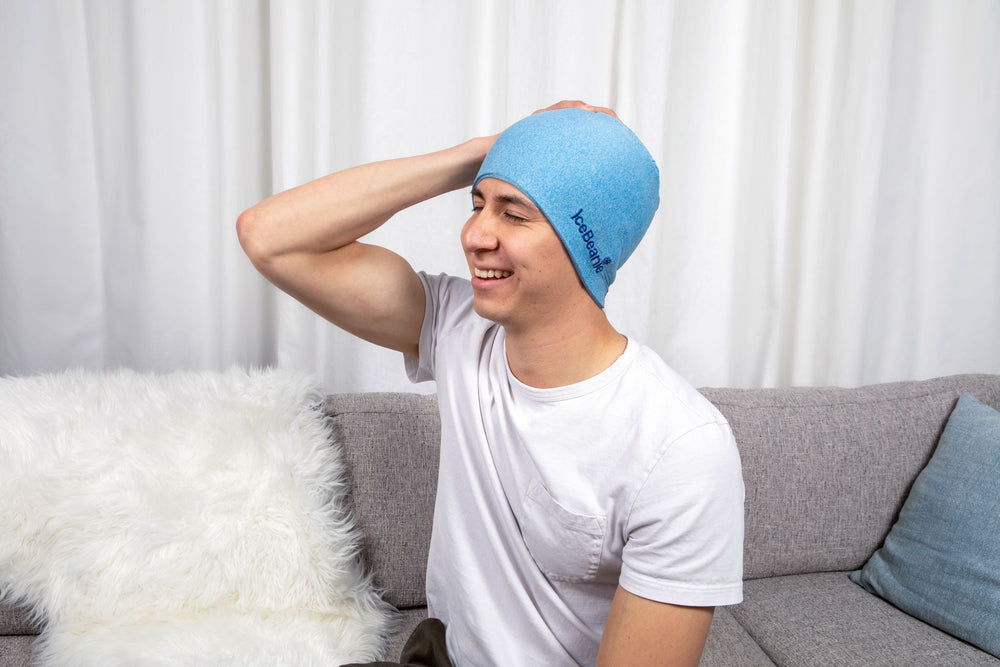 man smiling with ice beanie headache relief hat